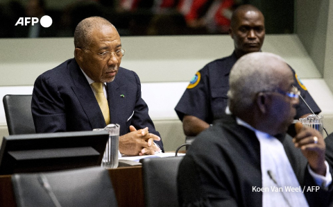 Former Liberian President Charles Taylor appears on September 26, 2013 at the Special Court for Sierra Leone in The Hague Koen van Weel - AFP