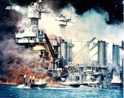 Battleship USS West Virginia burning on December 7, 1941 after the attack on Pearl Harbor - AFP