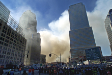 In this photo taken on September 12, 2001, billows of smoke escape from the stage of the World Trade Center in New York after the attacks of 11 September. 